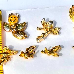 7 Cute Gold Plated Angel Pins. 1” & 1/4 “ in size.